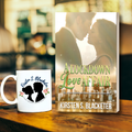 Romantic paperback novel A Lockdown Love Affair by Kirsten S. Blacketer featuring a couple about to kiss with the New York City skyline on it. Beside the book is a white mug featuring a couple silhouette and flowers on it.