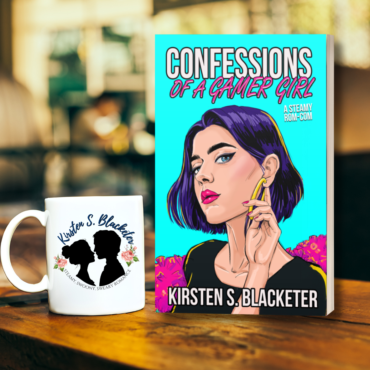 Paperback book of Confessions of a Gamer Girl with purple-haired woman against turquoise background.