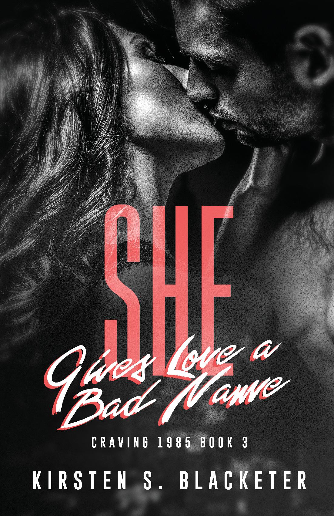 Black and white close-up of a man and woman kissing, bold red and white title text "She Gives Love a Bad Name" on cover.